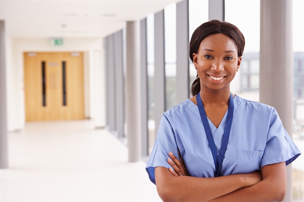 Healthcare professional in hospital corridor