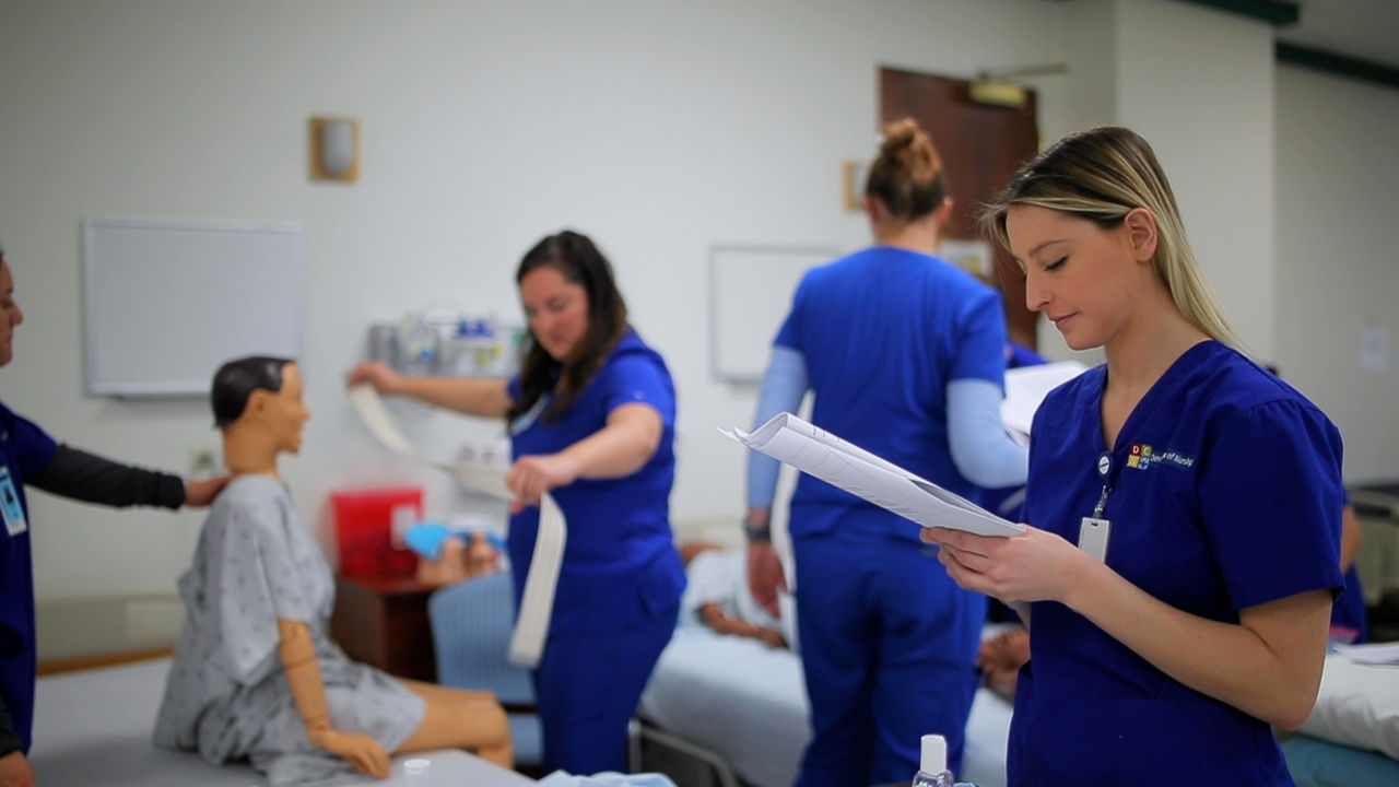 Nursing students practicing clinical skills